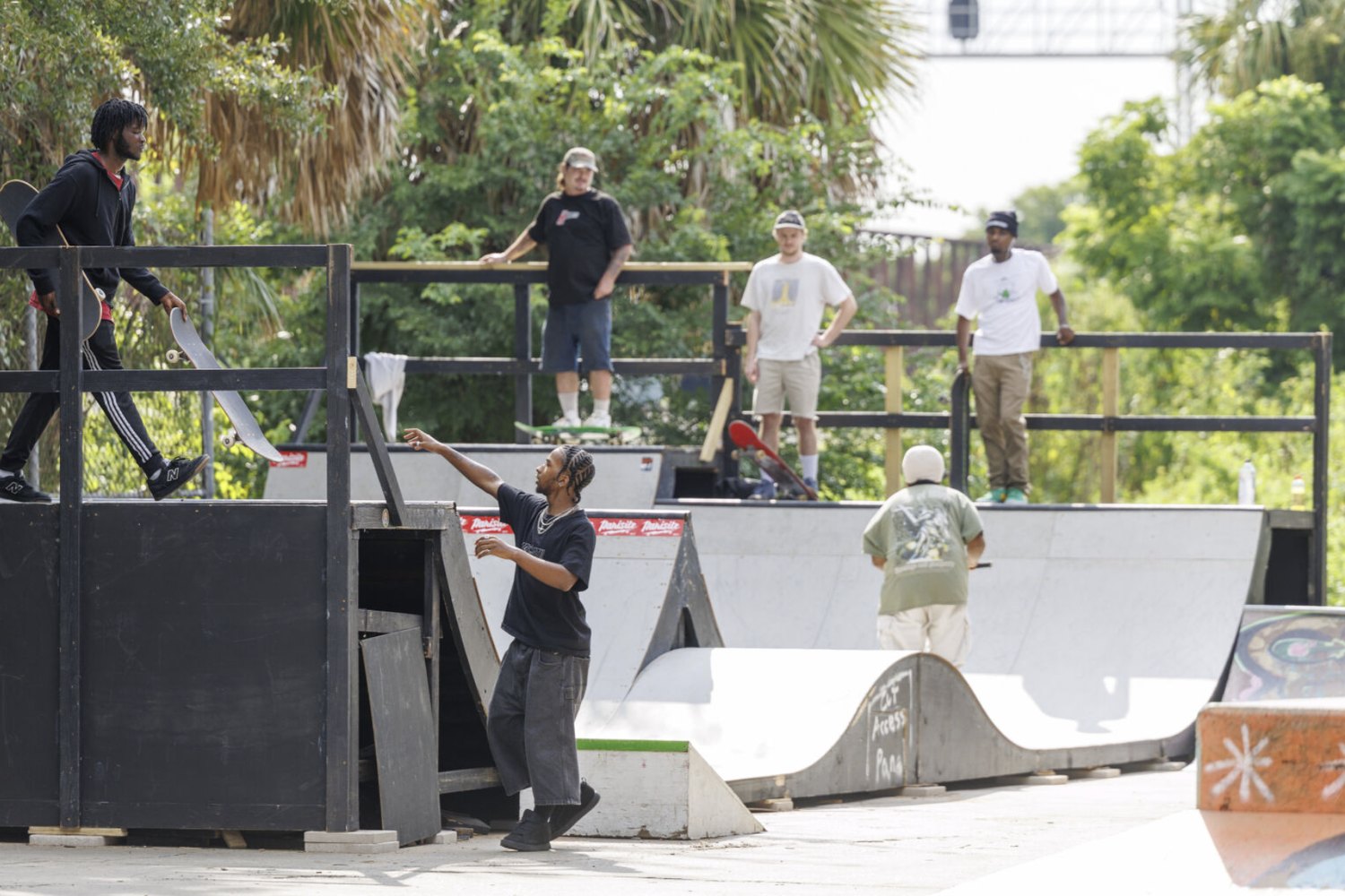 Skaters on the deck and the ramps of the rebuilt Parasite DIY skatepark in New Orleans